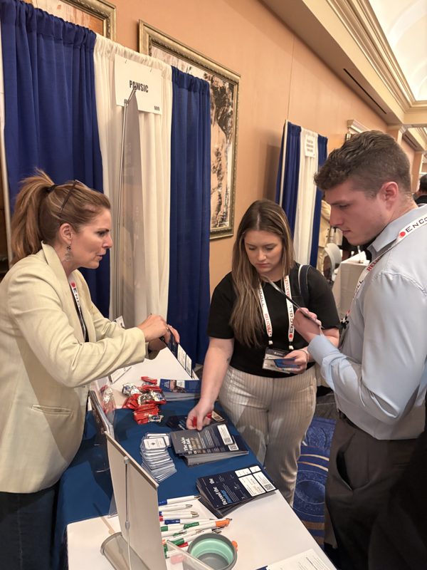 PAWSIC team member talking with attendees at the PAWSIC booth at SAWC Fall 2026