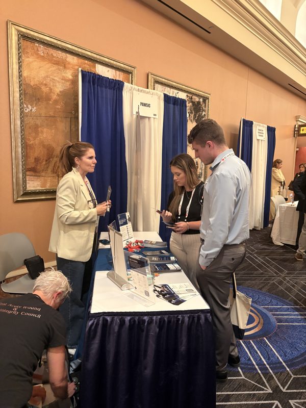 Attendees visiting the PAWSIC booth at SAWC Fall 2026